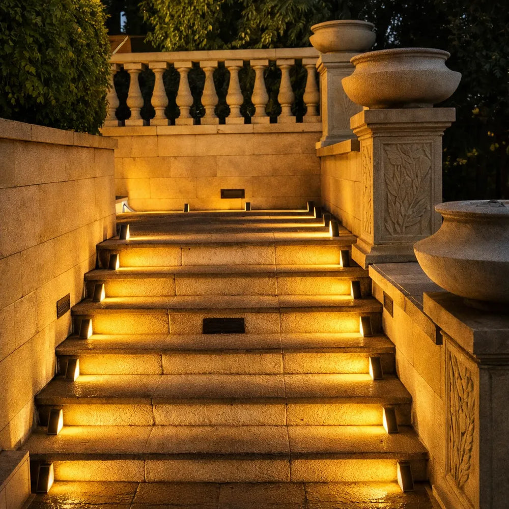 Solar step lights illuminating outdoor stone staircase with warm LED glow at night, solar stair and garden path lighting for Australian homes and landscapes