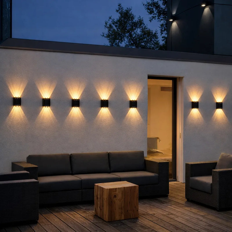 Solar LED wall lights illuminating outdoor alfresco patio at night, waterproof up-down solar fence lights for Australian homes